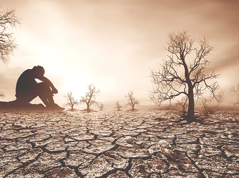 Concept of global warming and drought. People are sitting in despair because of the drought. a world without water