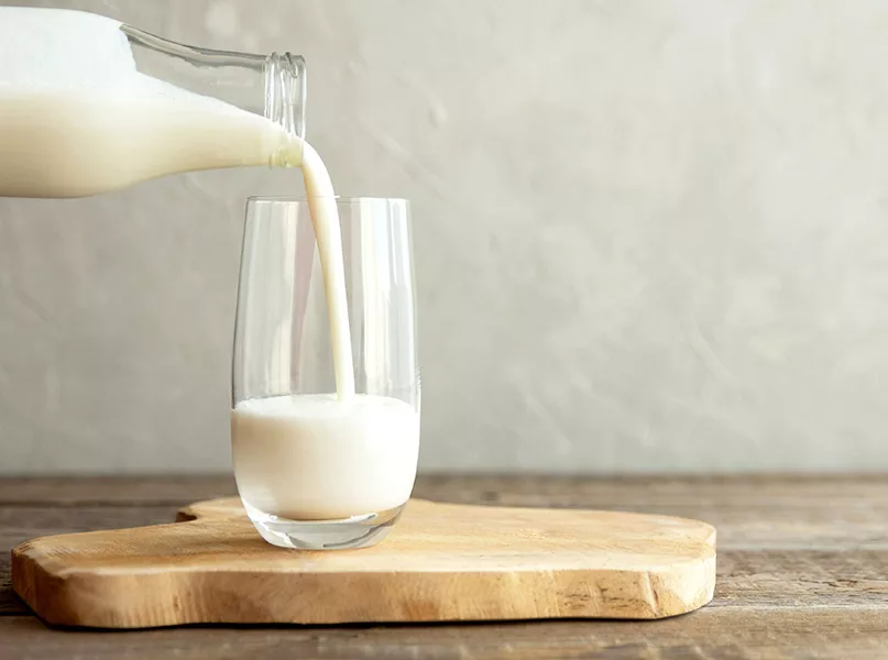 Milk being poured into a glass