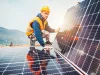 Workers assemble energy system with solar panel for electricity