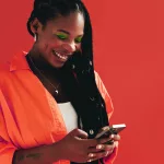 Woman sending a text message on her smartphone.