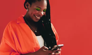 Woman sending a text message on her smartphone.