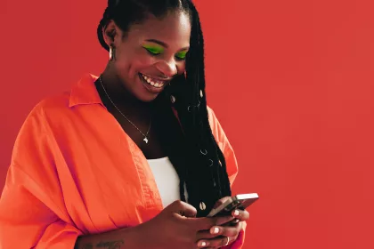 Woman sending a text message on her smartphone.