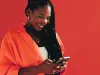 Woman sending a text message on her smartphone.
