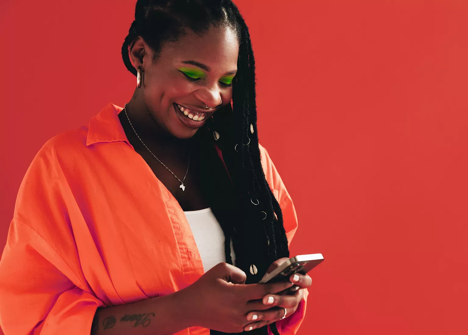 Woman sending a text message on her smartphone.