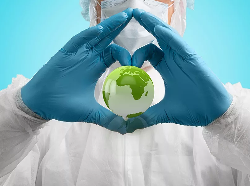 Hands of doctor holding Earth