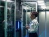 Technician works on a tablet in a data center