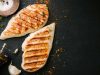 Grilled chicken breast served on black slate