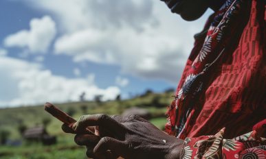 Kenyan woman uses mobile banking app