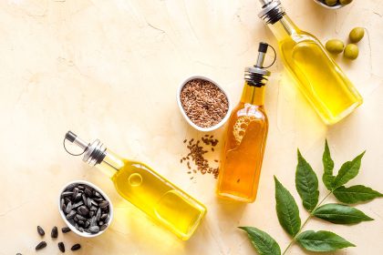 Different kind of cooking oil - sunflower olive and sesame oil with seeds