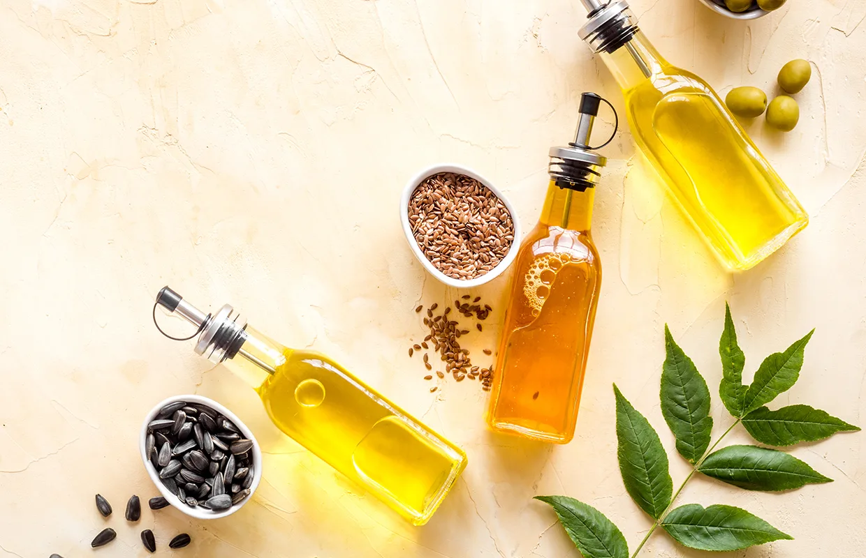 Different kind of cooking oil - sunflower olive and sesame oil with seeds